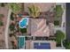Overhead view of home showcasing a pristine pool, ample yard space, and a well-maintained roof at 5919 S Banning St, Gilbert, AZ 85298