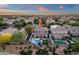 Expansive aerial view highlights this property's backyard pool, covered patio, and prime location in a vibrant neighborhood at 5919 S Banning St, Gilbert, AZ 85298