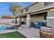 Enjoy the covered patio, sparkling pool, and ample seating area, perfect for outdoor entertaining at 5919 S Banning St, Gilbert, AZ 85298