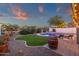Backyard with pool, lounge chairs, and landscaped area create a tranquil and inviting retreat at 5919 S Banning St, Gilbert, AZ 85298