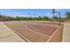 Well-maintained basketball court in community with painted lines and concrete perimeter at 5919 S Banning St, Gilbert, AZ 85298