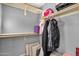 Walk-in closet with built-in shelving provides ample storage and organization options at 5919 S Banning St, Gilbert, AZ 85298