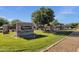 Welcome to Shamrock Estates, with beautiful stone signage, mature trees, and meticulously manicured landscaping at 5919 S Banning St, Gilbert, AZ 85298