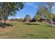 Picturesque community green space with mature trees, grassy areas, and walking paths offers a serene escape for residents at 5919 S Banning St, Gilbert, AZ 85298