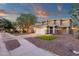 Charming two-story home with a well-manicured lawn and a spacious driveway for convenient parking at 5919 S Banning St, Gilbert, AZ 85298