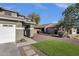 Beautiful front yard with low-maintenance desert landscaping and charming curb appeal at 5919 S Banning St, Gilbert, AZ 85298