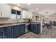 Bright, eat-in kitchen featuring stainless appliances, modern fixtures, and backyard views at 5919 S Banning St, Gilbert, AZ 85298