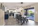 Bright eat-in kitchen with stainless appliances, pendant lighting, breakfast bar and access to outdoor patio space at 5919 S Banning St, Gilbert, AZ 85298