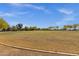 Expansive grassy park with walking trail, mature trees, and blue skies at 5919 S Banning St, Gilbert, AZ 85298