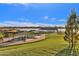 Scenic park view of covered picnic tables by the lake with grassy area and pathways at 5919 S Banning St, Gilbert, AZ 85298