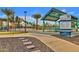 Gilbert Regional Park picnic shelter area with tables, landscaping, and signage at 5919 S Banning St, Gilbert, AZ 85298