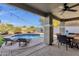 Beautiful backyard featuring a covered patio, sparkling pool, and relaxing lounge chairs at 5919 S Banning St, Gilbert, AZ 85298