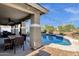 Gorgeous pool with patio space, lounge chairs, and outdoor seating area at 5919 S Banning St, Gilbert, AZ 85298