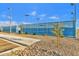 Community tennis courts with fresh surfaces surrounded by desert landscaping and walking paths at 5919 S Banning St, Gilbert, AZ 85298