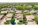 Aerial view of a neighborhood with mature trees, well-manicured lawns and a variety of architectural styles at 6570 S Pewter Way, Chandler, AZ 85249
