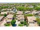 Expansive aerial view showcasing the home's location within a lush, residential community at 6570 S Pewter Way, Chandler, AZ 85249