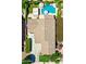 Aerial view of a home featuring a tile roof, swimming pool, patio area, and well-maintained landscaping at 6570 S Pewter Way, Chandler, AZ 85249