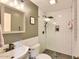 Updated bathroom features white subway tile, modern fixtures, and frameless glass shower door at 6570 S Pewter Way, Chandler, AZ 85249