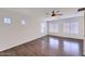 Spacious bedroom with wood-look floors, windows, and bright walls at 6570 S Pewter Way, Chandler, AZ 85249