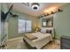 Comfortable bedroom with a plush bed, serene decor, and soft lighting at 6570 S Pewter Way, Chandler, AZ 85249