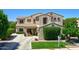 Charming two-story home with well-maintained lawn, mature landscaping, and inviting entryway at 6570 S Pewter Way, Chandler, AZ 85249