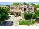 Attractive two-story home featuring mature trees, a well-kept lawn, and traditional architecture at 6570 S Pewter Way, Chandler, AZ 85249