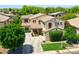 Beautiful two-story home with desert landscaping, mature trees, and a welcoming entrance at 6570 S Pewter Way, Chandler, AZ 85249