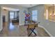 A light-filled game room with a foosball table and an adjacent sitting room at 6570 S Pewter Way, Chandler, AZ 85249