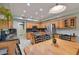 Spacious eat-in kitchen featuring wood cabinetry, granite countertops, and stainless steel appliances at 6570 S Pewter Way, Chandler, AZ 85249