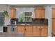 Kitchen featuring granite countertops, stainless steel dishwasher and a window for natural light at 6570 S Pewter Way, Chandler, AZ 85249