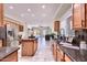 Bright kitchen featuring granite countertops, stainless steel appliances, and center island at 6570 S Pewter Way, Chandler, AZ 85249