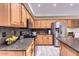 Kitchen with granite countertops, stainless steel appliances, and tile flooring at 6570 S Pewter Way, Chandler, AZ 85249