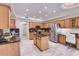 Spacious kitchen with stainless steel appliances, granite countertops and center island at 6570 S Pewter Way, Chandler, AZ 85249