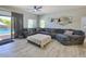Open living area with ample seating, neutral tones, lots of light and access to the pool at 6570 S Pewter Way, Chandler, AZ 85249