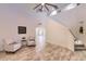 Open-concept living area showcasing tile floors, a staircase, and seamless transition to other rooms at 6570 S Pewter Way, Chandler, AZ 85249
