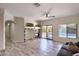 Living room featuring a fireplace and access to the backyard pool at 6570 S Pewter Way, Chandler, AZ 85249