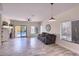 Cozy living room with fireplace and views of the pool at 6570 S Pewter Way, Chandler, AZ 85249