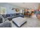 Large living room with comfortable seating and seamless flow into the dining area and kitchen at 6570 S Pewter Way, Chandler, AZ 85249