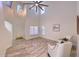 Bright and airy living area featuring soaring ceilings, neutral tones, and a cozy seating arrangement at 6570 S Pewter Way, Chandler, AZ 85249