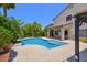 View of the pool and covered patio in the backyard of this single Gathering home at 6570 S Pewter Way, Chandler, AZ 85249