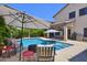 Backyard pool with ample seating and lounge space, perfect for outdoor entertaining at 6570 S Pewter Way, Chandler, AZ 85249