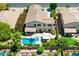 Exterior view of home featuring a pool, covered patio and lush landscaping creating a backyard oasis at 6570 S Pewter Way, Chandler, AZ 85249