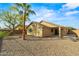 View of backyard with desert landscaping and covered patio at 6843 S 46Th Dr, Laveen, AZ 85339