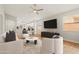 Bright living room with an open floor plan, neutral walls, and a ceiling fan at 6843 S 46Th Dr, Laveen, AZ 85339