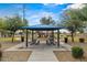 Community park featuring covered picnic tables and playground equipment at 6843 S 46Th Dr, Laveen, AZ 85339