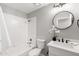 Bathroom featuring neutral paint, shower-tub combo, and modern fixtures at 7108 W Corrine Dr, Peoria, AZ 85381