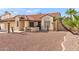 Charming single-story home with desert landscaping, complemented by mature palm trees and a welcoming front entrance at 7108 W Corrine Dr, Peoria, AZ 85381
