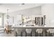 Modern kitchen featuring a large island with seating, white cabinetry, and stainless steel appliances at 7108 W Corrine Dr, Peoria, AZ 85381