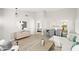 Open-concept living and dining area features wood-look floors and stylish décor at 7108 W Corrine Dr, Peoria, AZ 85381