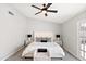 The primary bedroom is spacious with carpeted floors and a ceiling fan at 7108 W Corrine Dr, Peoria, AZ 85381